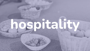 the word hospitality above baskets of fruit